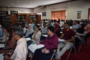 Participants of the workshop listening intently to the speaker